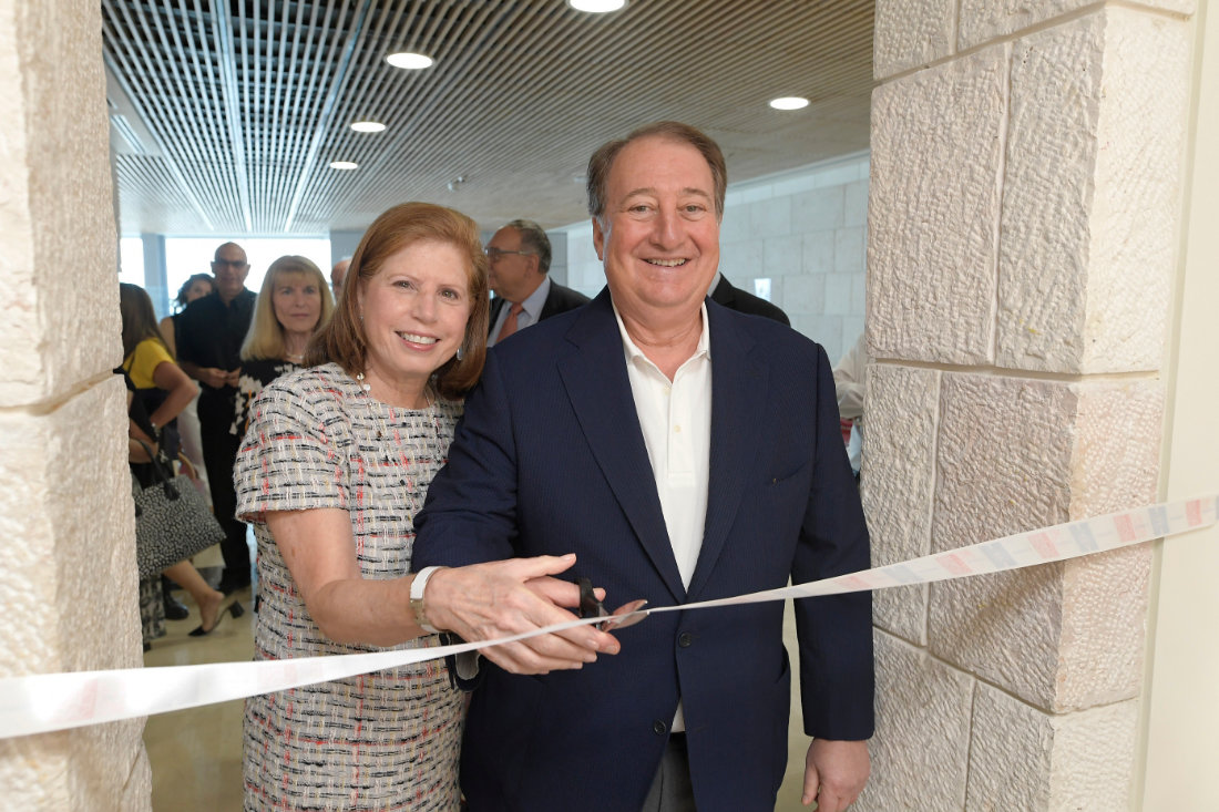 Ribbon-cutting with Abby and Howard Milstein.